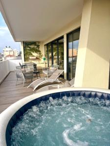 a hot tub on the deck of a building at Residence Provencal - Luxurious - 300m Palais - LRA CANNES in Cannes