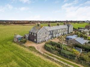 an aerial view of a large house in a field at Pass the Keys Charming Old Coastguards Cottage in Chichester