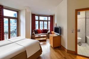 Postel nebo postele na pokoji v ubytování Le Palace Hotel
