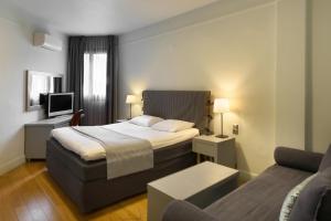 Postel nebo postele na pokoji v ubytování Le Palace Hotel