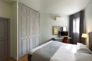 Postel nebo postele na pokoji v ubytování Le Palace Hotel