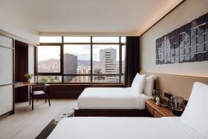 Posteľ alebo postele v izbe v ubytovaní Nobu Hotel Barcelona