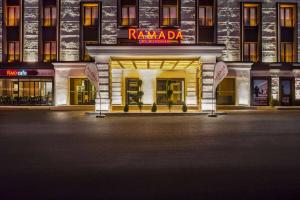 a building with a sign on the front of it at Ramada by Wyndham Erzurum in Erzurum