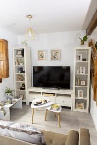 Telewizja i/lub zestaw kina domowego w obiekcie Casa Poulo Padrón