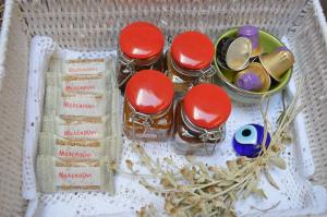 a basket with a bunch of spices and spoons at Casa Muse Kastellorizo Whole House in Meyisti +53 photos