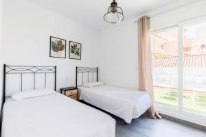 Posteľ alebo postele v izbe v ubytovaní Casa Palacio Sanlúcar de Barrameda