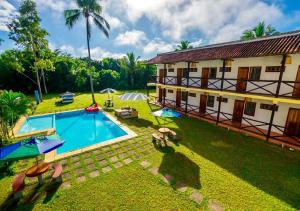 an aerial view of a house with a swimming pool at Pousada Casarão de Itaúnas in Itaúnas