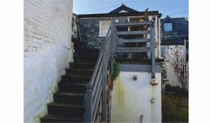 a set of stairs leading up to a building at The Sail Loft in Lostwithiel