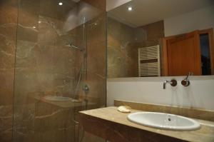 a bathroom with a sink and a shower at Playa de Muro - Nordvillas in Muro