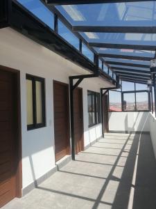 a view of a building with awning and windows at Apartamentos MI FAMILIA in Sucre