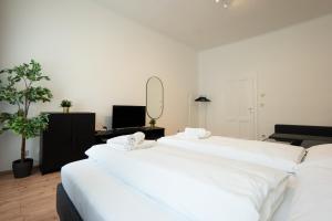 Posteľ alebo postele v izbe v ubytovaní Lovely 1-bedroom apartment next to Praterstern