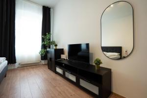 Televízia a/alebo spoločenská miestnosť v ubytovaní Lovely 1-bedroom apartment next to Praterstern