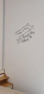 a wall with a piece of writing on it at Hotel Franca in Misano Adriatico