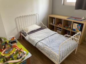 a childs bedroom with a bed and a book shelf at Maison de charme - Sospel in Sospel