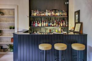 a blue bar with two stools in front of it at Cluny Bank in Forres