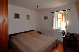 Postel nebo postele na pokoji v ubytování Kis-Balatoni Ökoporta