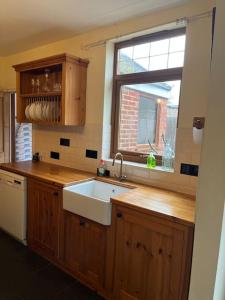a kitchen with a sink and a window at Ivanhoe Home from Home in Freshwater