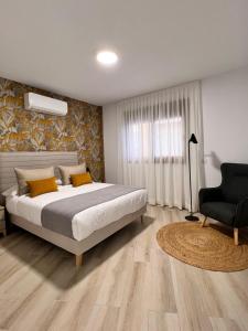 Postel nebo postele na pokoji v ubytování Apartamentos Doña Emilia