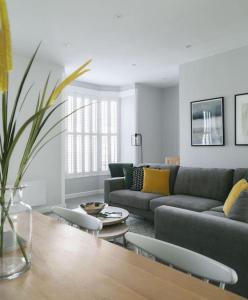 a living room with a couch and a table at 45a Oxford Street in Harrogate