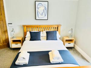 Giường trong phòng chung tại Horsforth Lodge