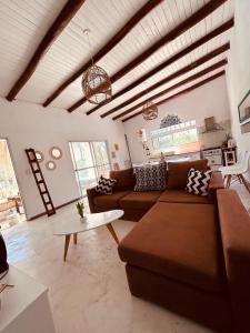 a living room with a couch and a table at Mirador del Río in Villa La Rivera +17 photos