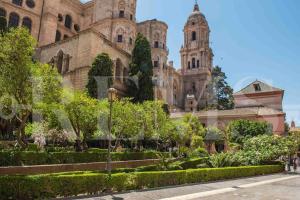 a building with a garden in front of it at Inviting duplex in front of Picasso Museum by REMS in Málaga