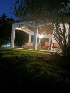 a house with a couch and chairs in a yard at Luxury Chez-Moi in Serres