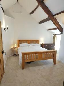 Ένα ή περισσότερα κρεβάτια σε δωμάτιο στο Hallagather Self Catering