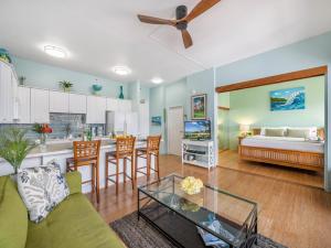 a living room with a couch and a table at Penthouse With Fabulous Ocean View Near Waikiki Beach in Honolulu