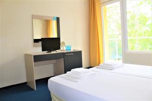 Postel nebo postele na pokoji v ubytování Pop Art Hotel
