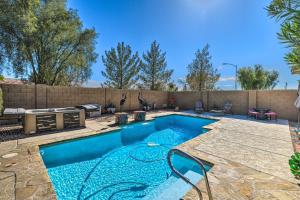 a swimming pool in a backyard with a fence at Bella Casa Coolidge Home with Pool and Hot Tub! in Coolidge