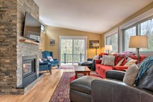 a living room with couches and a fireplace at Cozy Home with Sauna Mins to Stowe Mountain Resort in Stowe
