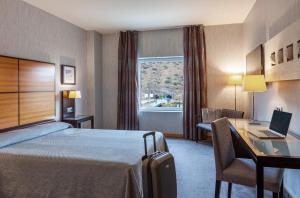 Postel nebo postele na pokoji v ubytování Hotel Macià Real De La Alhambra