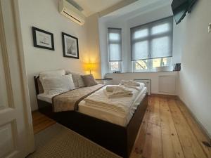 A bed or beds in a room at Just Studios
