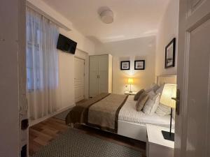 A bed or beds in a room at Just Studios