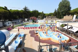 an overhead view of a pool at a water park at Maïana Resort in La Grande-Motte