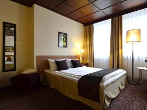 Postel nebo postele na pokoji v ubytování Comfort Hotel tom Kyle