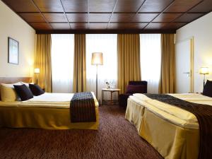 Postel nebo postele na pokoji v ubytování Comfort Hotel tom Kyle