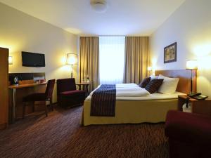 TV a/nebo společenská místnost v ubytování Comfort Hotel tom Kyle