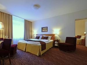 Postel nebo postele na pokoji v ubytování Comfort Hotel tom Kyle