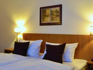 Postel nebo postele na pokoji v ubytování Comfort Hotel tom Kyle