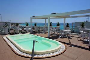 a hot tub on the roof of a building at M&F Hotel in Gallipoli