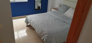 Posteľ alebo postele v izbe v ubytovaní Apartamento Ciudad de las Ciencias