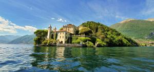 a castle on a island in the water at La Terrazza di Como in Como