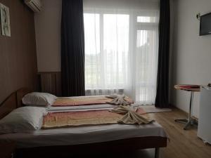 Postel nebo postele na pokoji v ubytování Miraj-MD