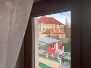 a view of a building from a window at Hotel U Beránků in Libochovice