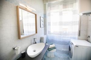 a bathroom with a sink and a toilet and a window at Chic and Freak Atelier in Como +30 photos