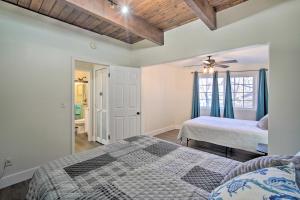 a bedroom with two beds and a ceiling at Relaxing Lake Arrowhead Home about 1 Mi to Lake! in Lake Arrowhead