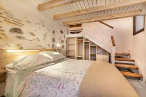 a bedroom with a bed and a staircase at Aires de Toledo in Toledo