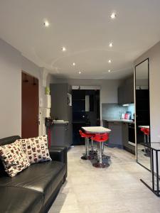 a living room with a couch and a table at Mandana in Évian-les-Bains +38 photos